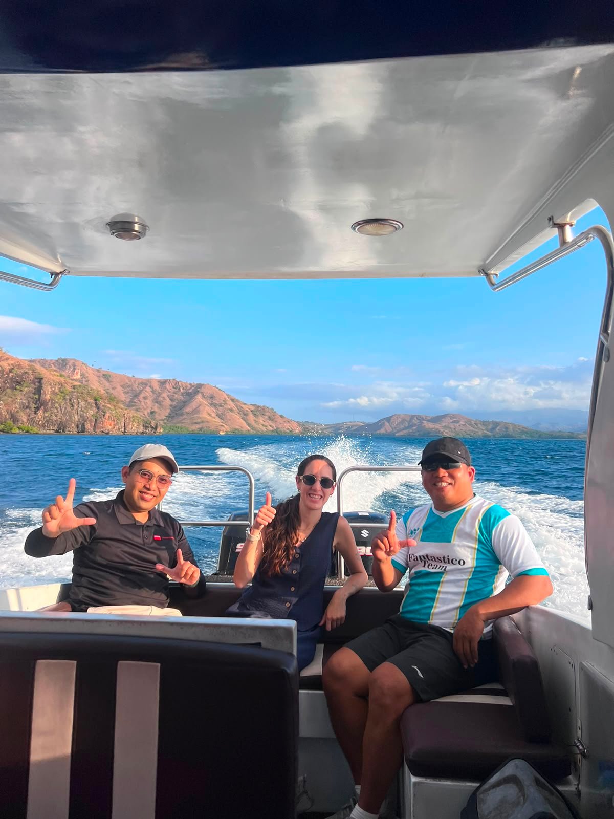Melali Indonesia Journeys team members on board a speedboat crossing between islands in Komodo National Park