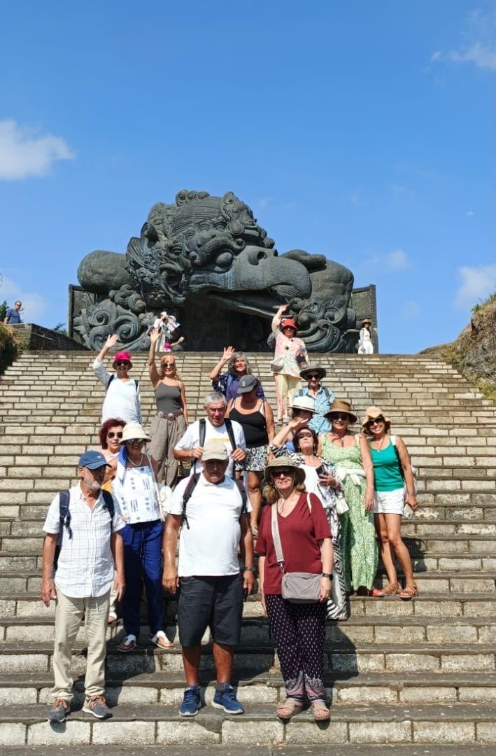 The Portuguese group on the stairway below the monumental Garuda Wisnu Kencana statue at GWK Cultural Park, Bali