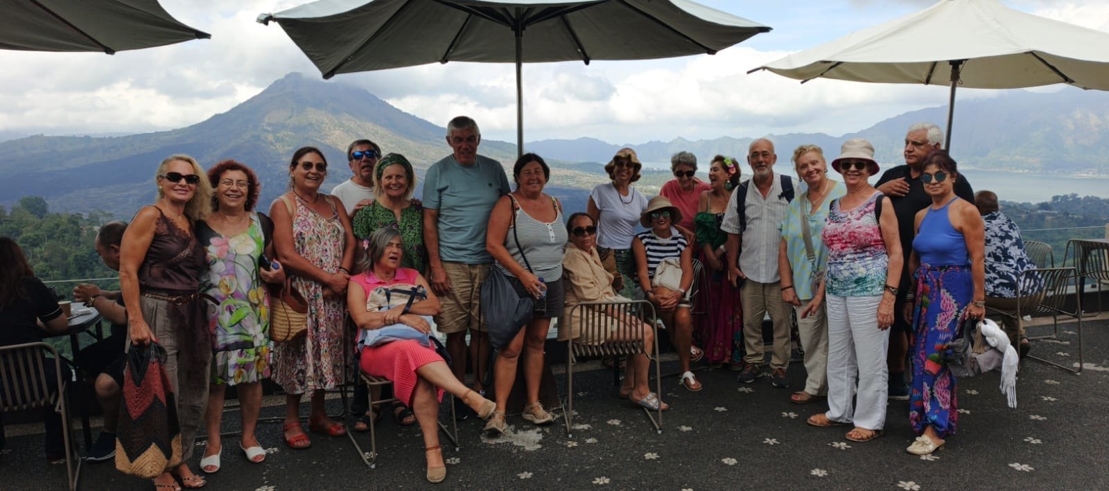 The Portuguese group on a terrace in the Kintamani Highlands with Mount Batur and Lake Batur behind them