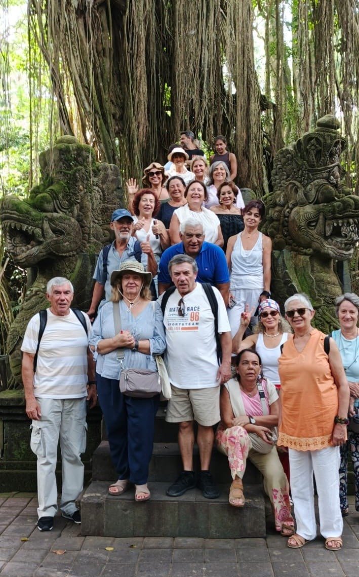 The Portuguese group gathered on the naga stairway beneath a giant banyan tree at the Sacred Monkey Forest Sanctuary in Ubud